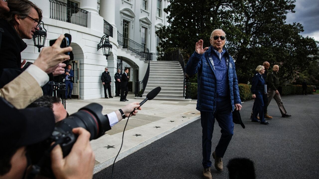 US President Joe Biden stops to speak to the press before boarding Marine One as he departs from the South Lawn of the White House on April 5, 2024. Biden is heading to Baltimore to tour the collapsed Francis Scott Key Bridge