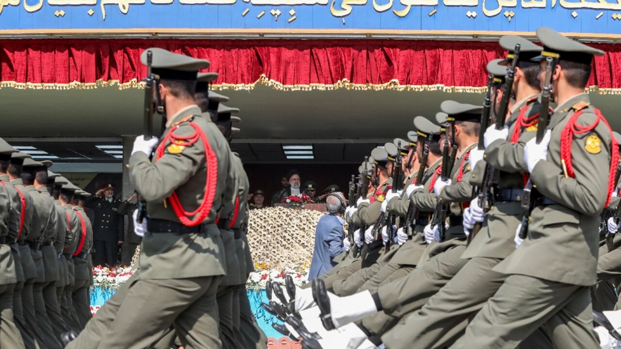 Soldiers march past Iran's President Ebrahim Raisi during a military parade in Tehran on April 17, 2024 Soldiers march past Iran's President Ebrahim Raisi during a military parade in Tehran on April 17, 2024