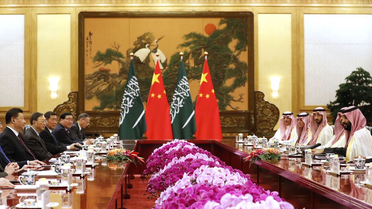 Saudi Crown Prince Mohammed bin Salman (R) attends a meeting with Chinese President Xi Jinping (L) at the Great Hall of the People in Beijing on Feb. 22, 2019.