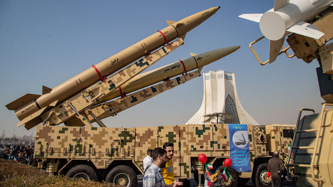 Missiles and UAV's are showed for the people on the side of the road in Tehran, Iran, on Feb. 11, 2024.