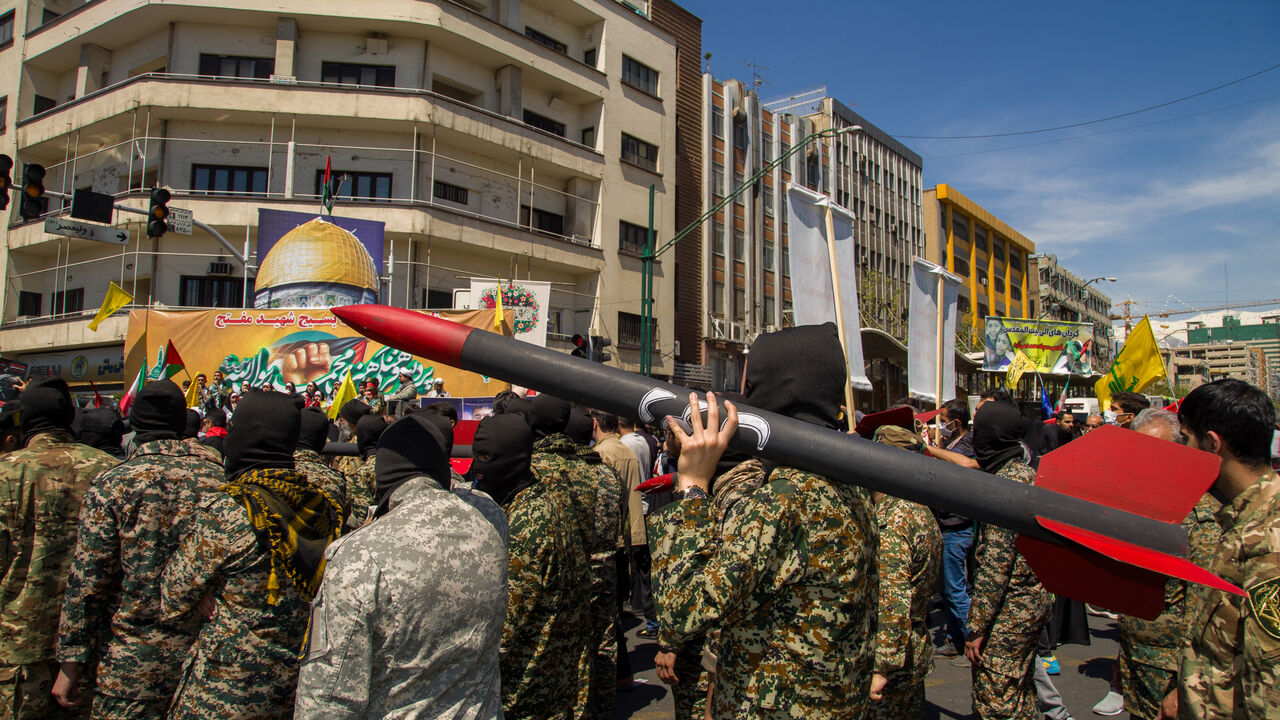 Iranian attend the funeral procession for seven Islamic Revolutionary Guard Corps members killed in a strike in Syria, which Iran blamed on Israel, in Tehran on April 5, 2024. The Guards, including two generals, were killed in the air strike on April 1, which levelled the Iranian embassy's consular annex in Damascus. The funeral ceremony coincides with the annual Quds (Jerusalem) Day commemorations, when Iran and its allies stage marches in support of the Palestinians. (Photo by Hossein Beris / Middle East