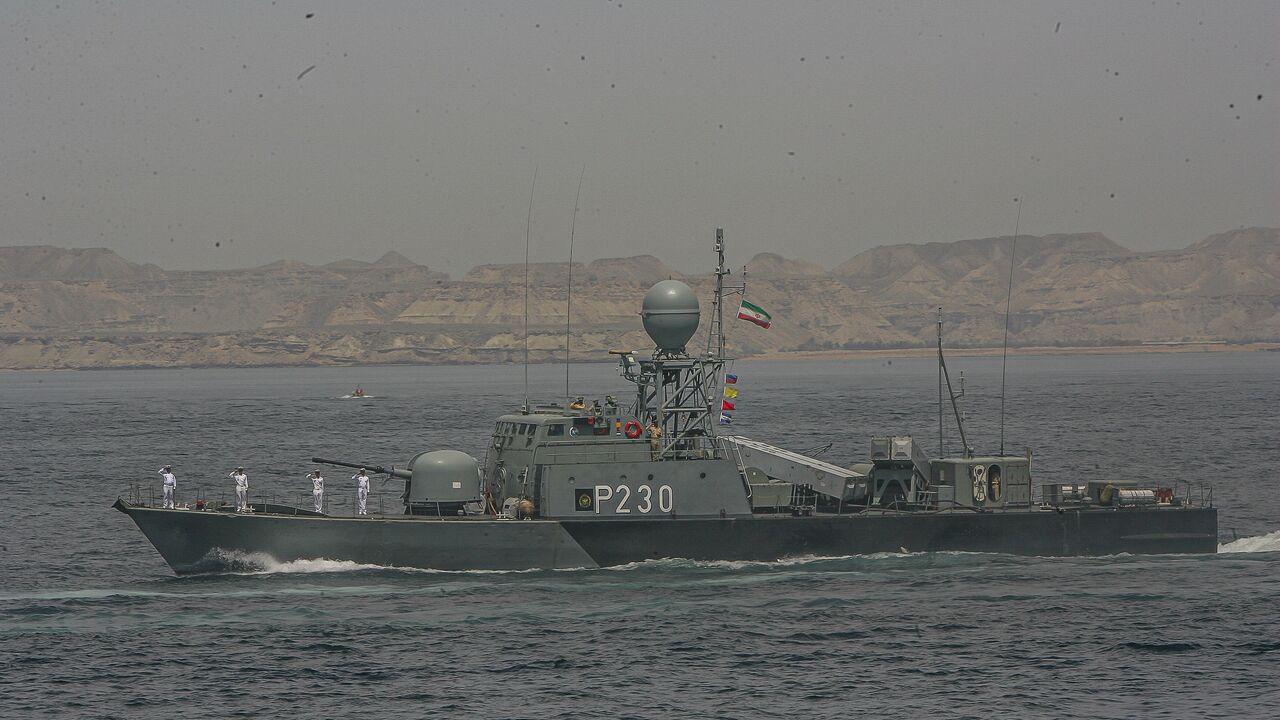An Iranian Navy vessel participates in Iran's elite Islamic Revolutionary Guard Corps special forces military drill in the Gulf of Oman at an undisclosed location near Iranian southern port town of Bandar-e Jask on Thursday, April 6, 2006.