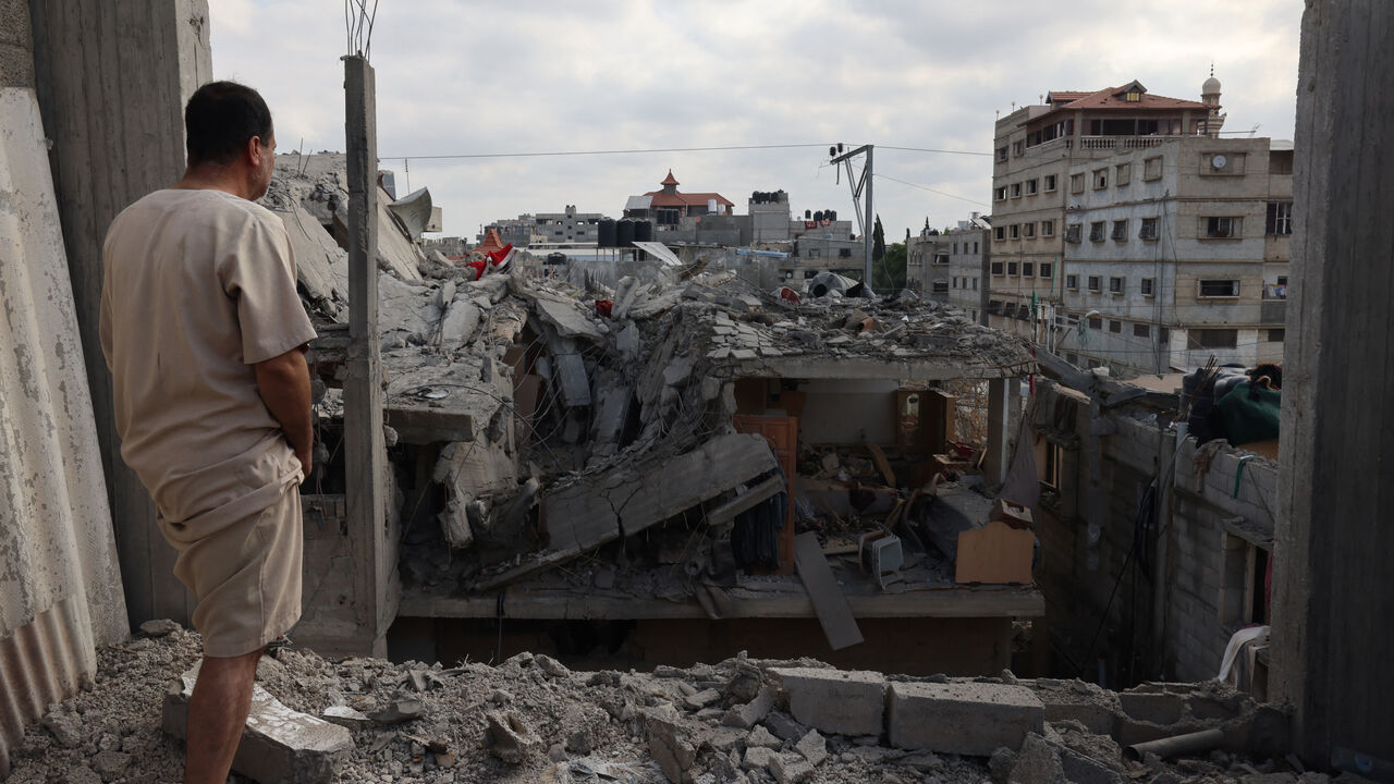 TOPSHOT - A Palestinian looks at the damage to buildings after Israeli bombardment in Rafah in the southern Gaza Strip, on April 29, 2024 amid the ongoing conflict between Israel and the Palestinian militant group Hamas. (Photo by AFP) (Photo by -/AFP via Getty Images)