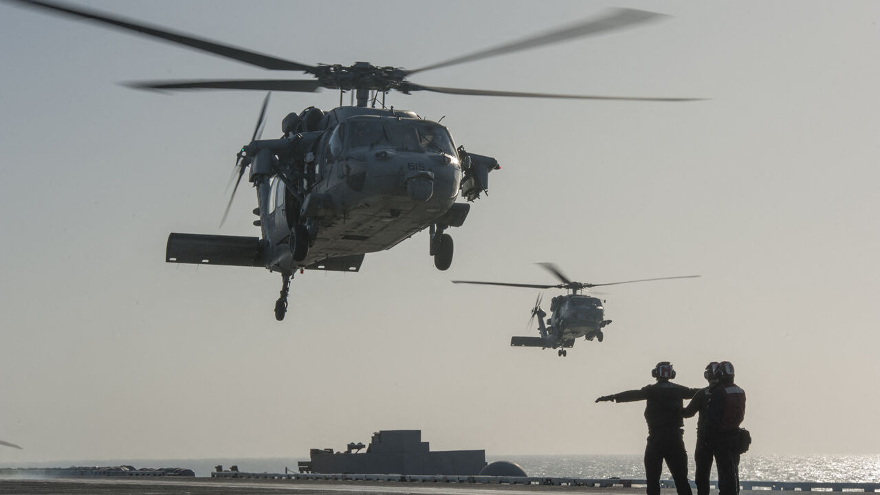 This US Navy photo released Jan. 15, 2015 shows an MH-60S Sea Hawk helicopter from the Red Lions of Helicopter Sea Combat Squadron (HSC) 15 as it prepares to land on the flight deck of the Nimitz-class aircraft carrier USS Carl Vinson (CVN 70) on Jan. 13, 2015 in the Gulf. 