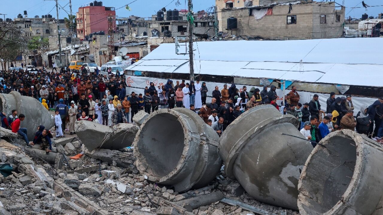 Gazans at Eid morning prayers at the flattened Al-Farooq mosque in Rafah Gazans at Eid morning prayers at the flattened Al-Farooq mosque in Rafah