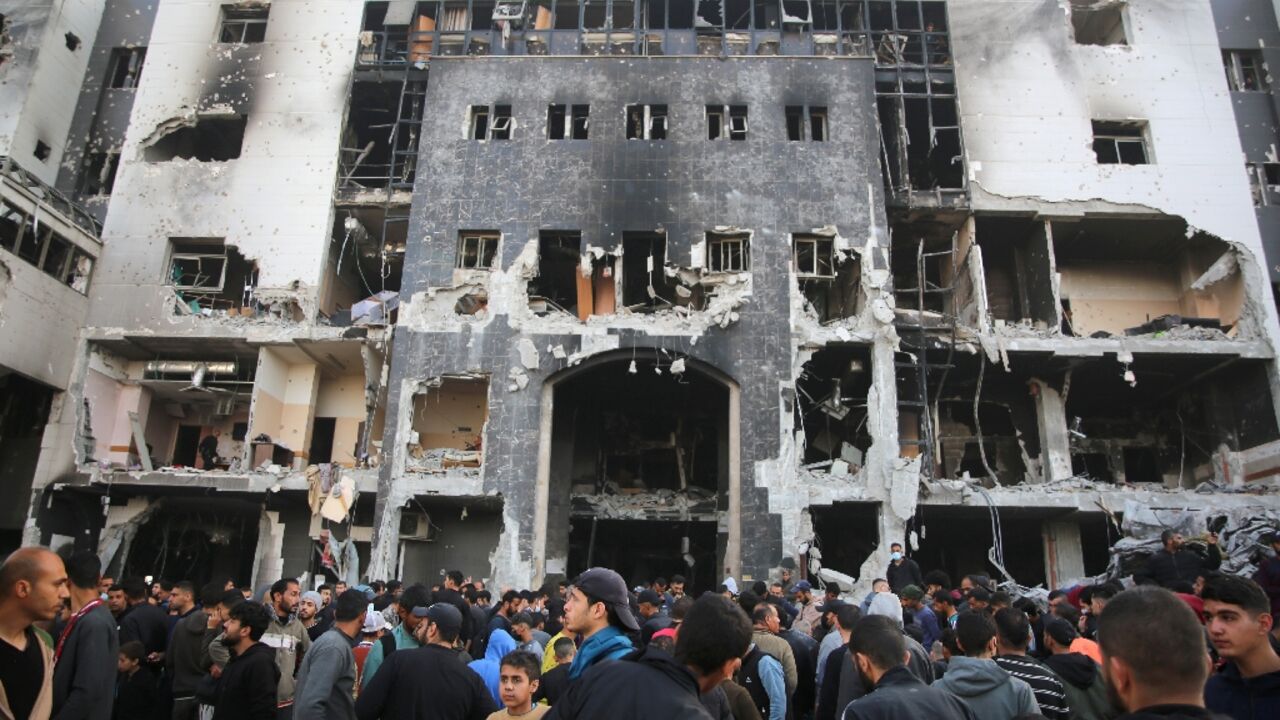 Palestinians gathered to inspect the damage to Gaza's Al-Shifa hospital after the Israeli military withdrew following a two-week battle