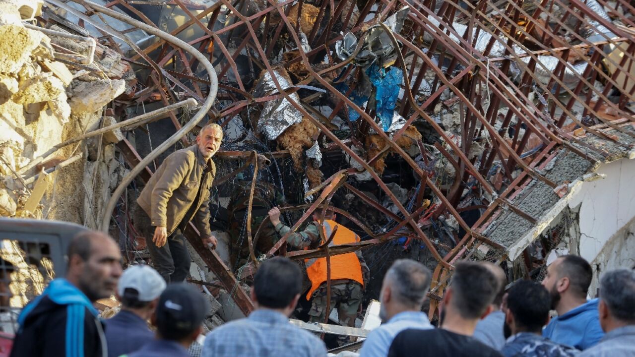 Emergency services were searching for victims under the rubble as sirens wailed in the upscale Damascus district of Mazzeh Emergency services were searching for victims under the rubble as sirens wailed in the upscale Damascus district of Mazzeh