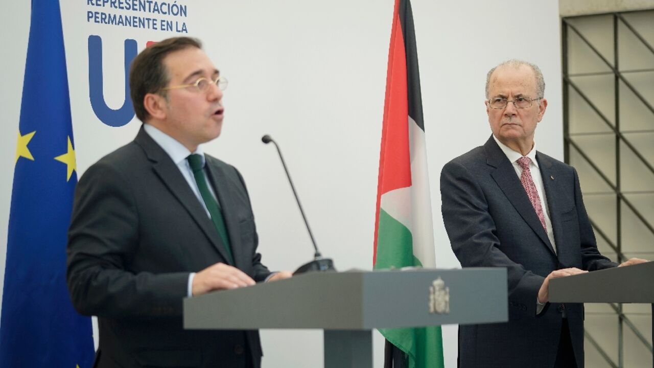 Spanish Foreign Minister Jose Manuel Albares (L) and Palestinian Prime Minister Mohammad Mustafa spoke side-by-side in Brussels 