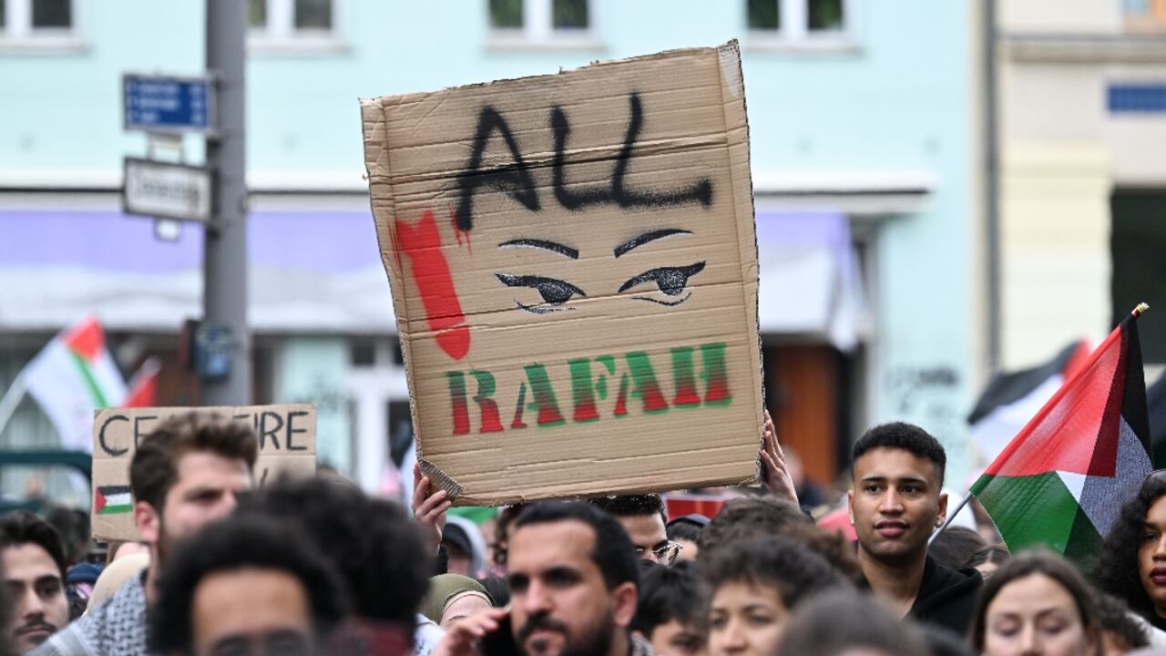 A participant holds up a placard during a pro-Palestinian protest in Berlin on May 18