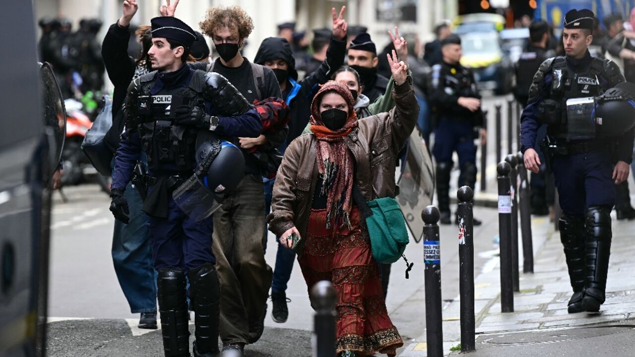 Student demonstrators were escorted out of the Sciences Po building by police