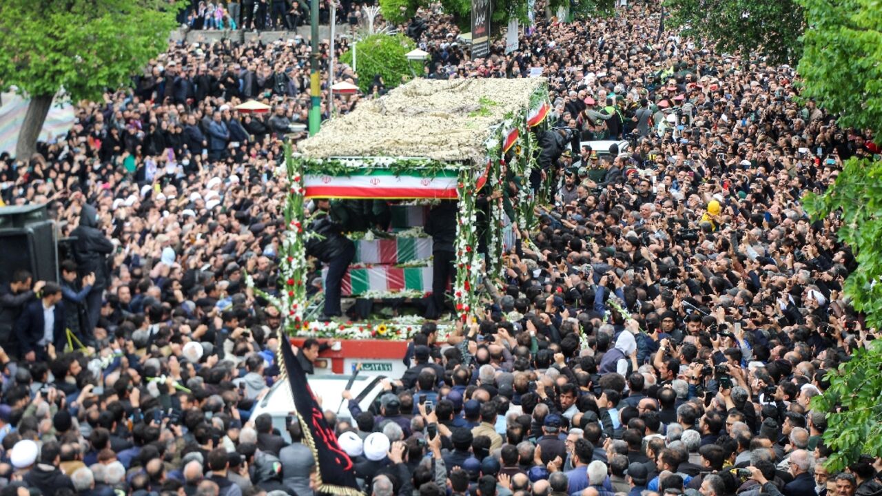 A truck carrying the bodies of Iranian president Ebrahim Raisi and seven members of his entourage winds its way through huge crowds in the northwestern city of Tabriz, where he was headed when he died in a Sunday helicopter crash A truck carrying the bodies of Iranian president Ebrahim Raisi and seven members of his entourage winds its way through huge crowds in the northwestern city of Tabriz, where he was headed when he died in a Sunday helicopter crash