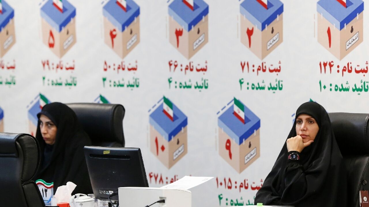 Iranian electoral officials at a registration office in Tehran ahead of snap elections following Ebrahim Raisi's death Iranian electoral officials at a registration office in Tehran ahead of snap elections following Ebrahim Raisi's death