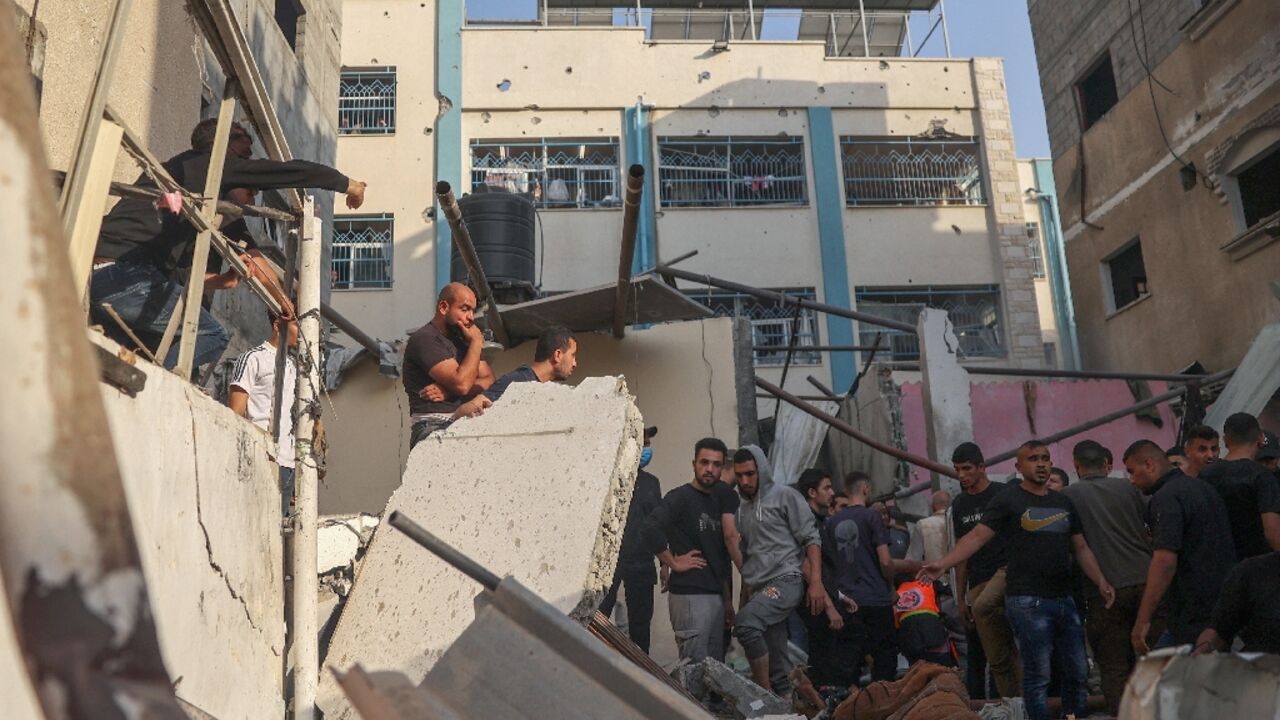 Palestinians search for casualties in the rubble of a house destroyed in an Israeli strike on Rafah, in the southern Gaza Strip Palestinians search for casualties in the rubble of a house destroyed in an Israeli strike on Rafah, in the southern Gaza Strip
