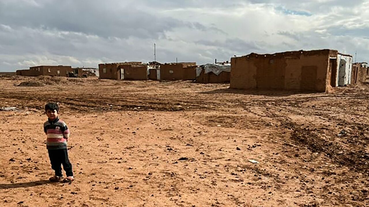 A handout picture provided by the Syrian Emergency Task Force (SETF) shows a displaced Syrian child in the Rukban camp, in a no-man's land in southern Syria A handout picture provided by the Syrian Emergency Task Force (SETF) shows a displaced Syrian child in the Rukban camp, in a no-man's land in southern Syria