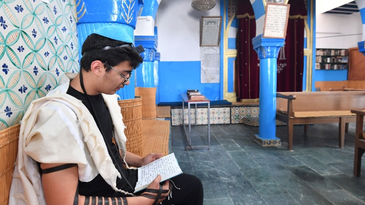 A Tunisian man prays at a synagogue in Djerba during an annual Jewish pilgrimage A Tunisian man prays at a synagogue in Djerba during an annual Jewish pilgrimage