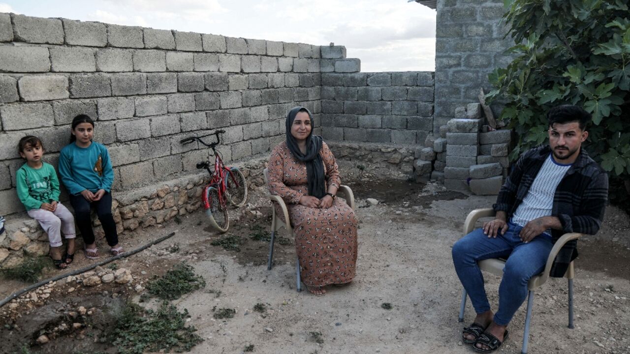 Bassem Eido, a 20-year-old Iraqi man from the Yazidi community, sits with his mother and sisters, in the village of Solagh in the Sinjar region Bassem Eido, a 20-year-old Iraqi man from the Yazidi community, sits with his mother and sisters, in the village of Solagh in the Sinjar region