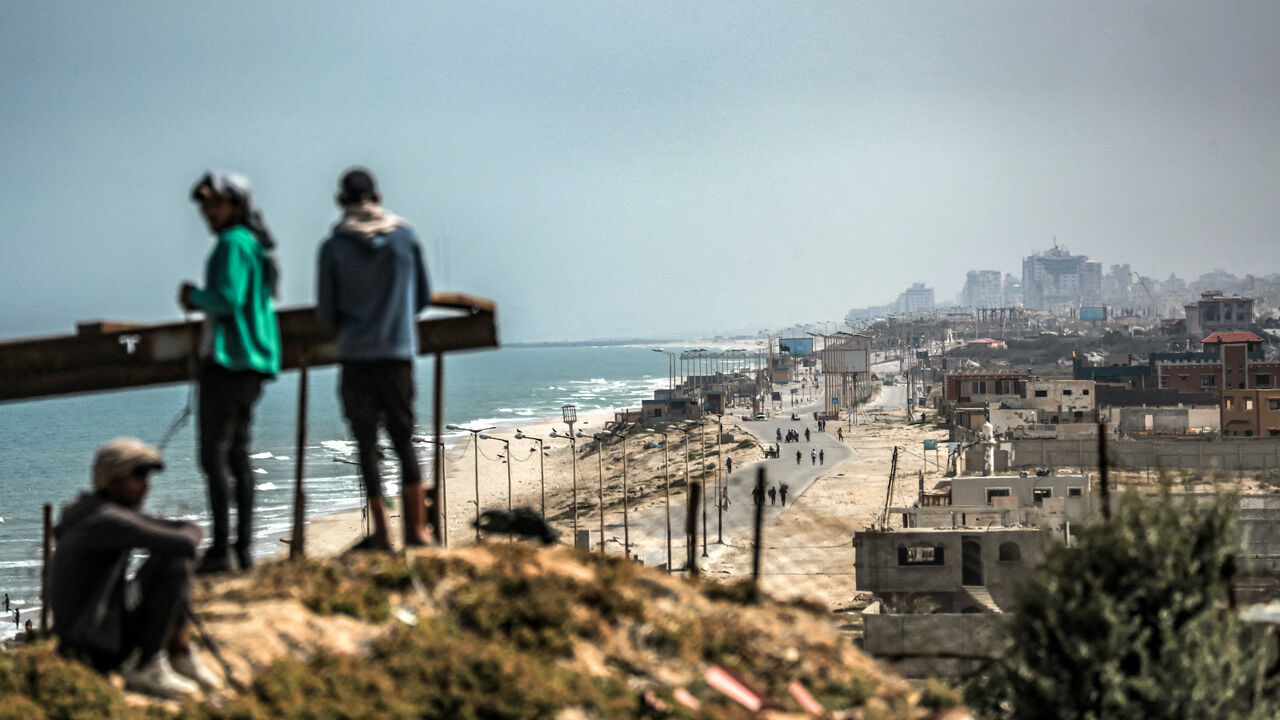 Youths gather atop an elevated area in al-Zahra in the central Gaza Strip on April 23, 2024 amid the ongoing conflict in the Palestinian territory between Israel and the militant group Hamas.