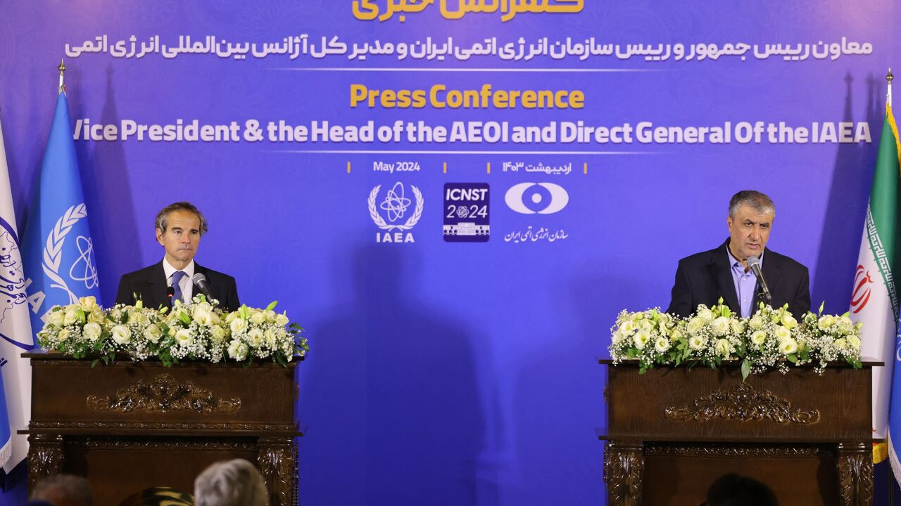 Mohammad Eslami, the head of Iran's atomic energy department, and Director General of the International Atomic Energy Agency (IAEA) Rafael Grossi take part in a press conference in Isfahan on May 7, 2024.