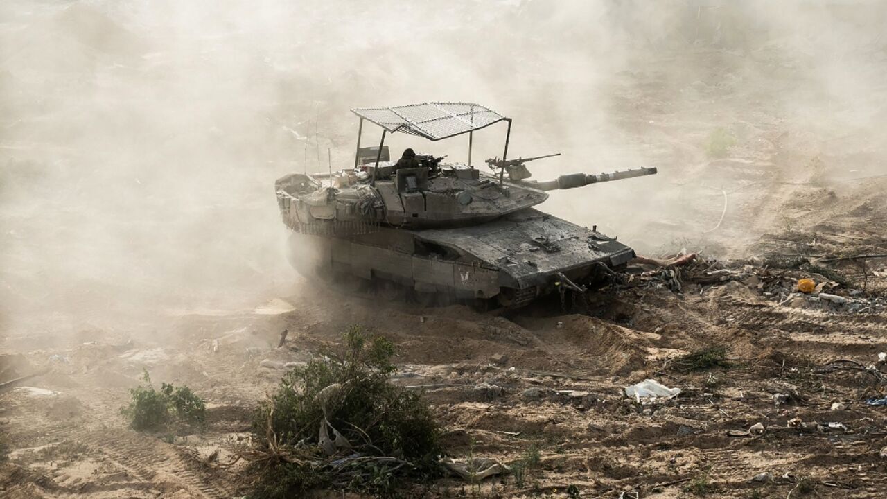 An Israeli tank is seen during operations around Jabalia in the northern Gaza Strip An Israeli tank is seen during operations around Jabalia in the northern Gaza Strip