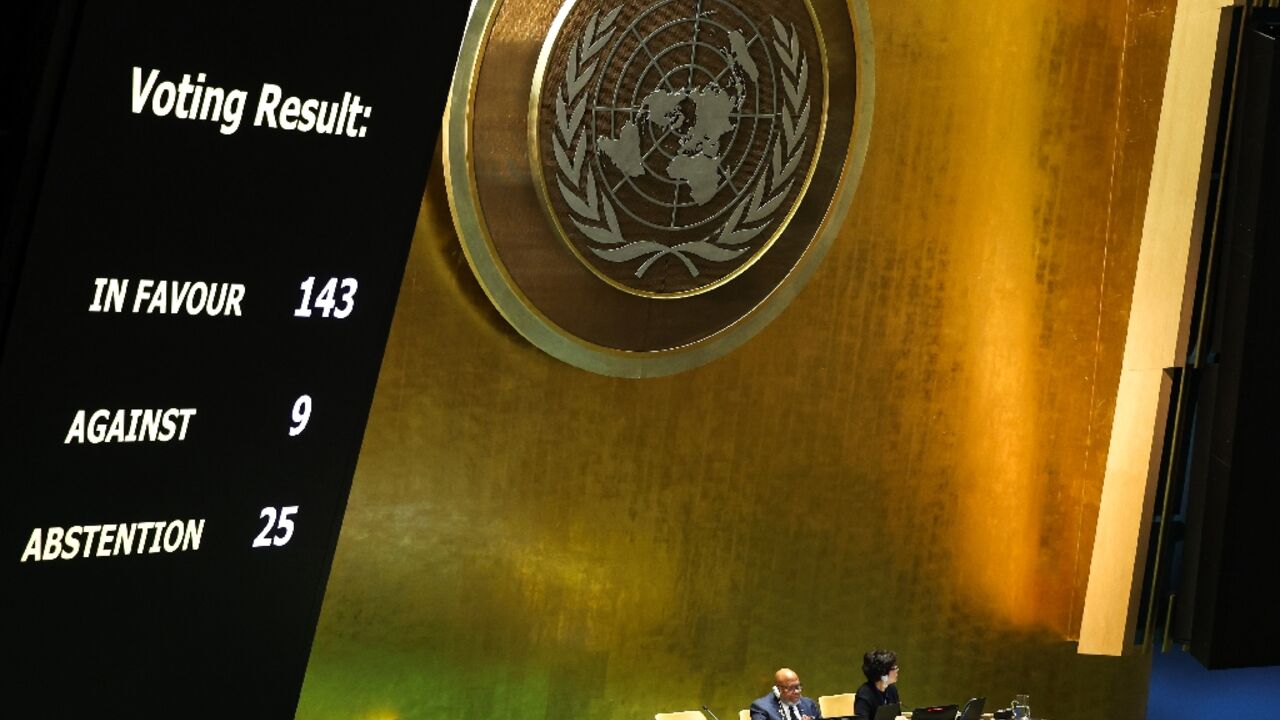 The results of a vote on a resolution for the UN Security Council to reconsider and support the full membership of Palestine into the United Nations is displayed during a special session of the UN General Assembly