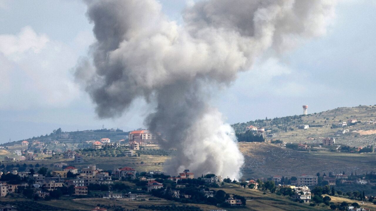 Seen from northern Israel, smoke billows above the Lebanese village of Mays al-Jabal during Israeli bombardment 