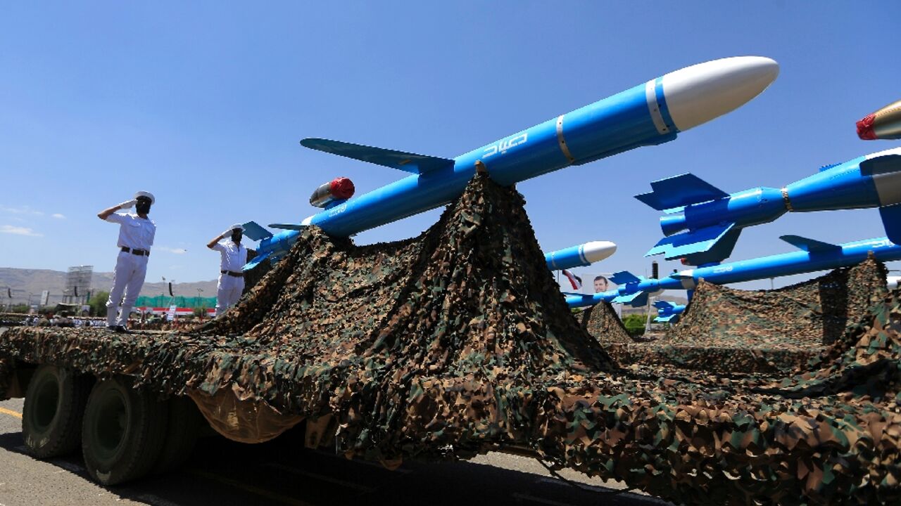 Huthi soldiers stand guard on a missile carrier during a military parade in September 2023 Huthi soldiers stand guard on a missile carrier during a military parade in September 2023