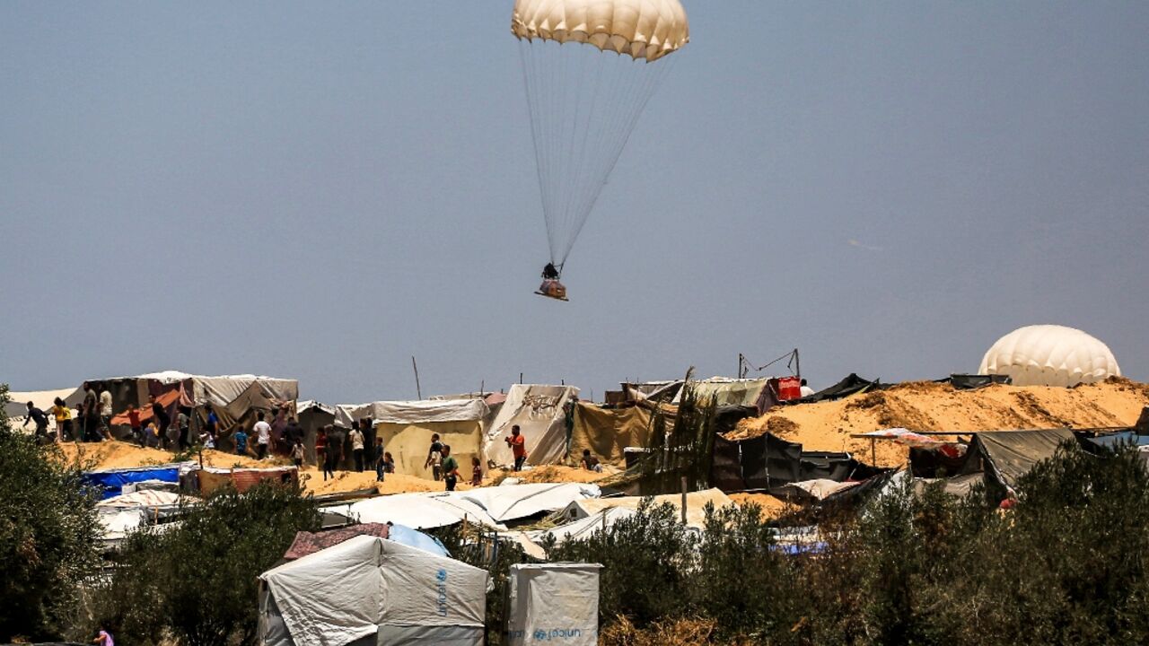 Humanitarian aid dropped on Khan Yunis falls near tents sheltering Palestinians displaced by conflict Humanitarian aid dropped on Khan Yunis falls near tents sheltering Palestinians displaced by conflict