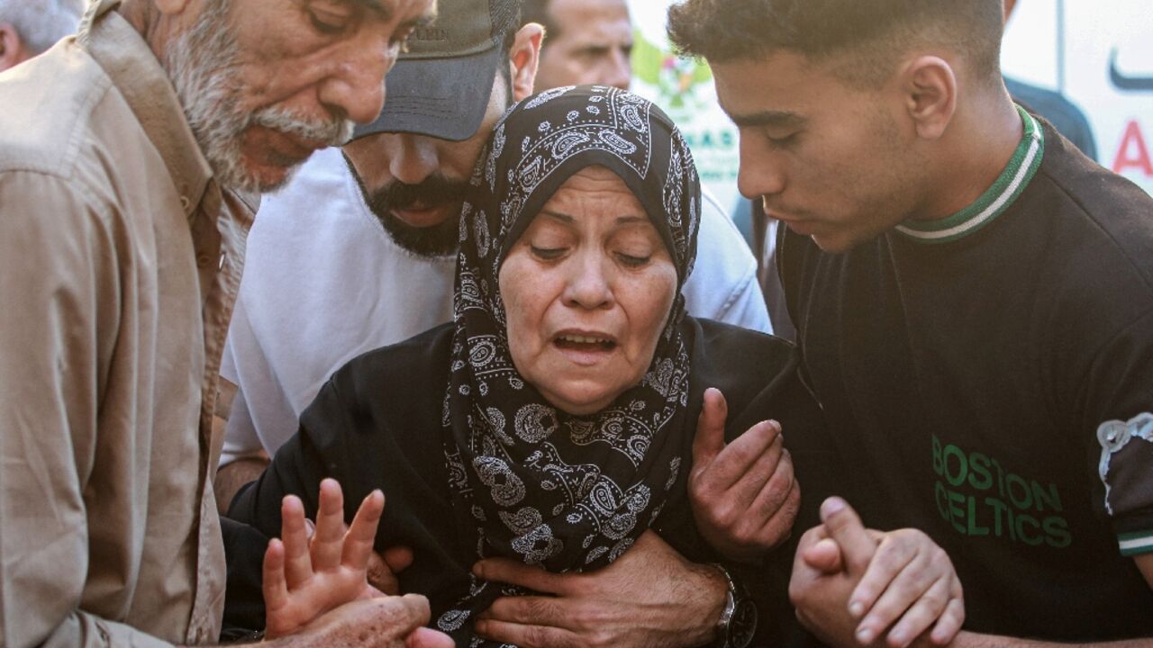 A Palestinian woman mourns her relative, killed in an Israeli strike in central Gaza's Deir al-Balah A Palestinian woman mourns her relative, killed in an Israeli strike in central Gaza's Deir al-Balah