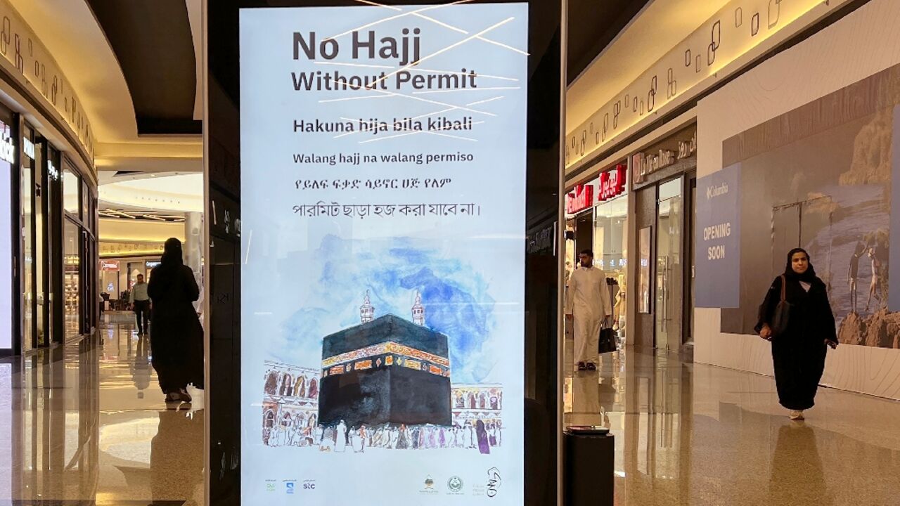 A billboard in a Riyadh shopping mall stresses that a permit is required to be able to perform the hajj A billboard in a Riyadh shopping mall stresses that a permit is required to be able to perform the hajj