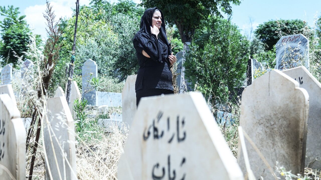 Rozkar Ibrahim, a Kurdish lawyer and women's rights activist, is working to find out the names and causes of death of women buried at the cemetery
Rozkar Ibrahim, a Kurdish lawyer and women's rights activist, is working to find out the names and causes of death of women buried at the cemetery
