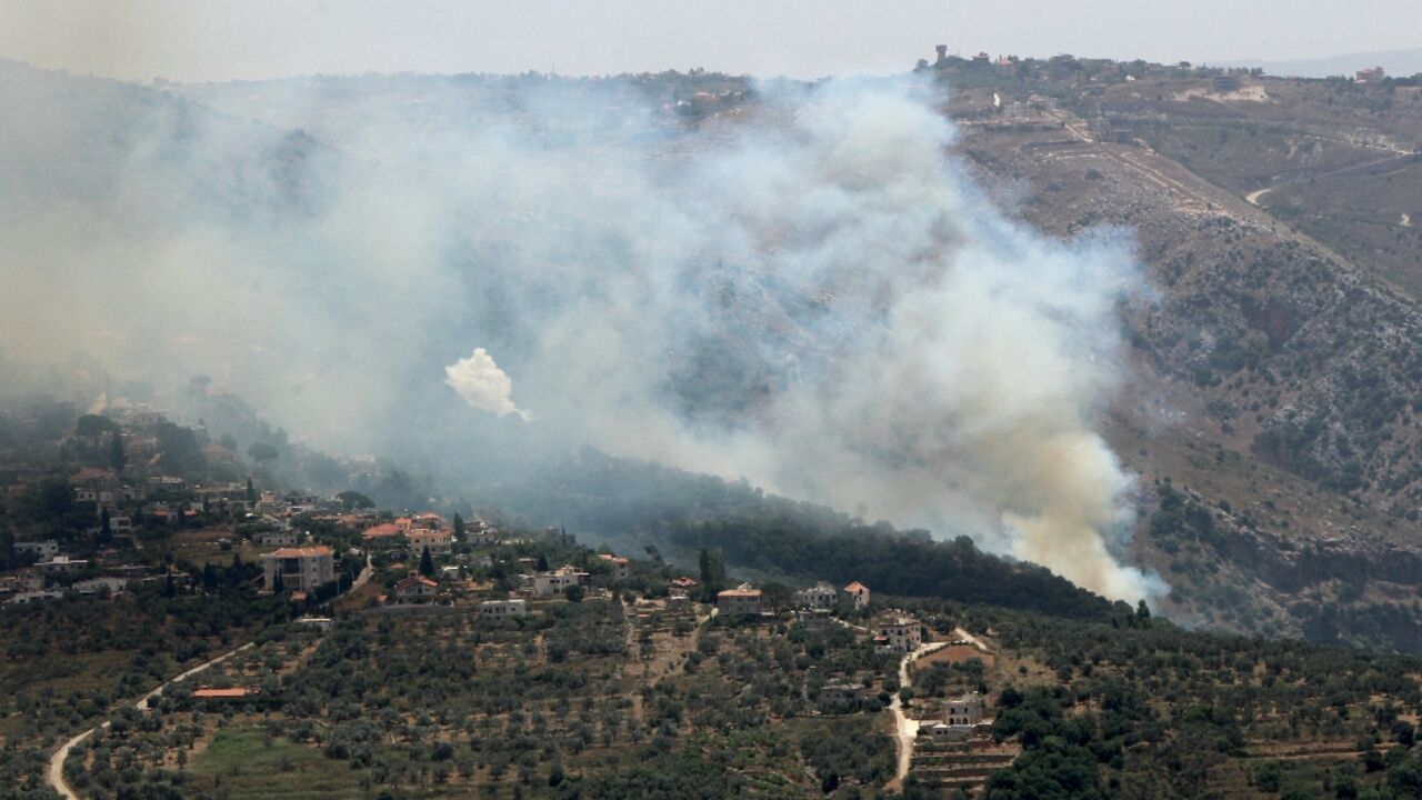 Smoke billows from fires ignited by Israeli shelling on the forested areas of the southern Lebanese village of Deir Mimas Smoke billows from fires ignited by Israeli shelling on the forested areas of the southern Lebanese village of Deir Mimas