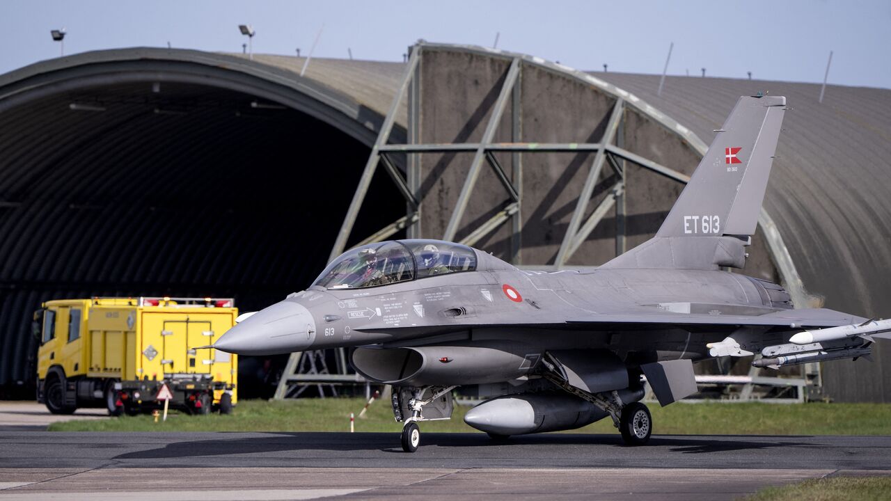 Argentina's Minister of Defence Luis Petri (R) arrives in a Danish F-16 aircraft at Skrydstrup Airport, Denmark, prior his meeting with Denmark's Minister of Defence on April 16, 2024. 