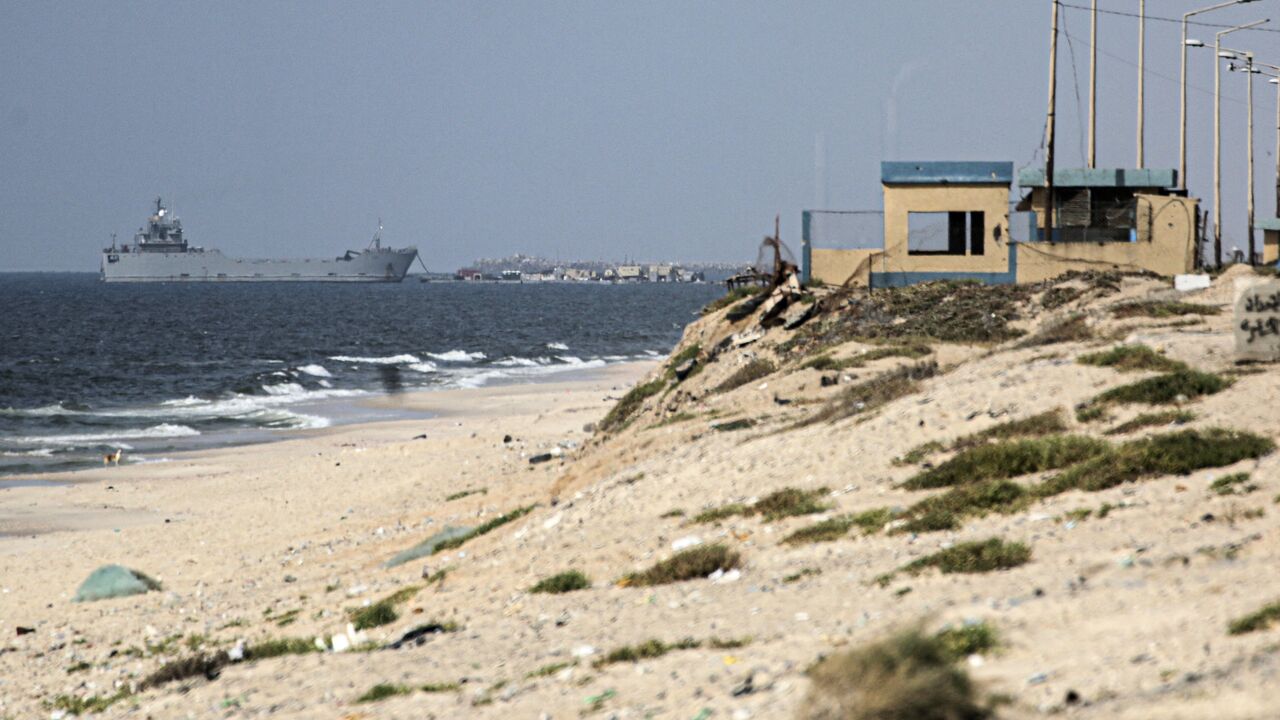 A ship transporting international humanitarian aid is moored at the US-built Trident Pier near Nuseirat in the central Gaza Strip on May 21, 2024, amid the ongoing conflict between Israel and the Palestinian militant Hamas group. 