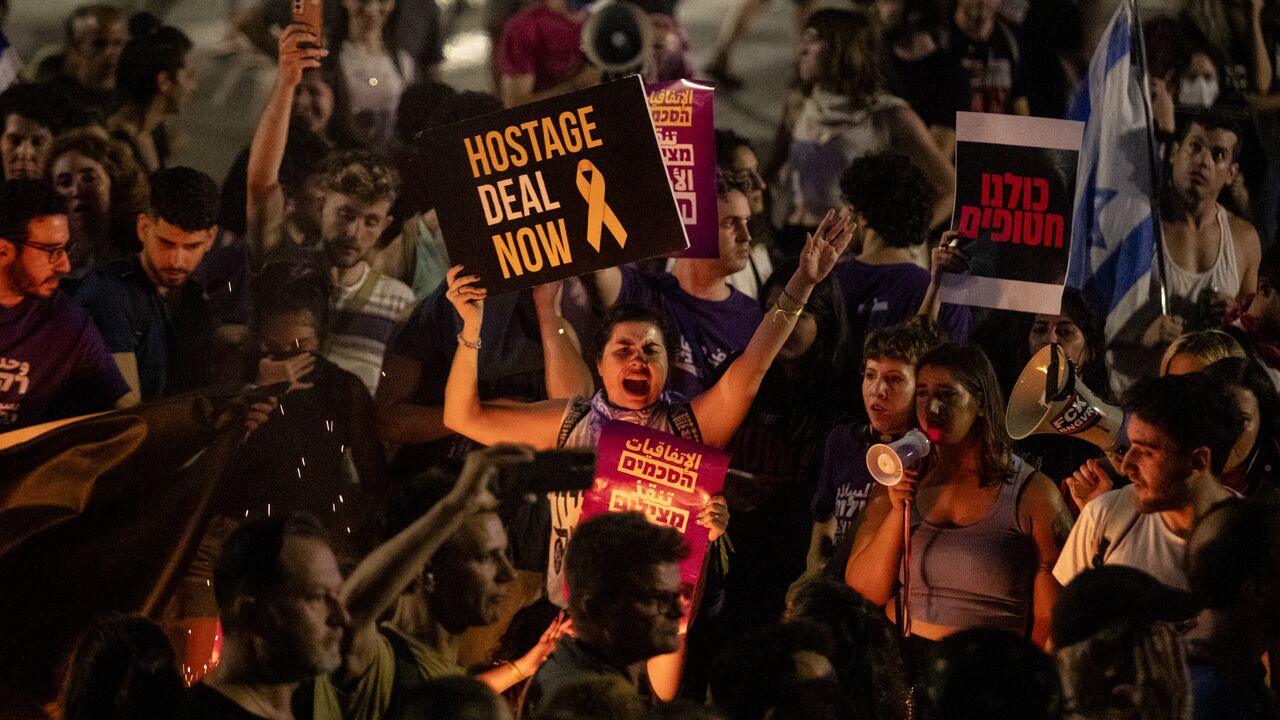 Protesters hold signs during a demonstration calling for a hostages deal with Hamas and against Israeli Prime Minister Benjamin Netanyahu and his government on June 1, 2024, in Tel Aviv, Israel. 