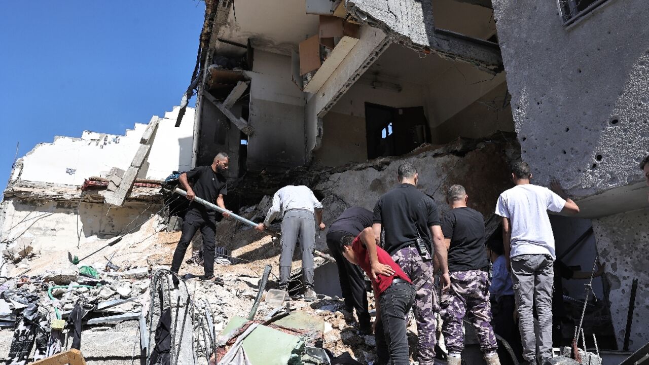People search the rubble of a building hit by bombardment at the Nur Shams refguee camp in the occupied West Bank People search the rubble of a building hit by bombardment at the Nur Shams refguee camp in the occupied West Bank