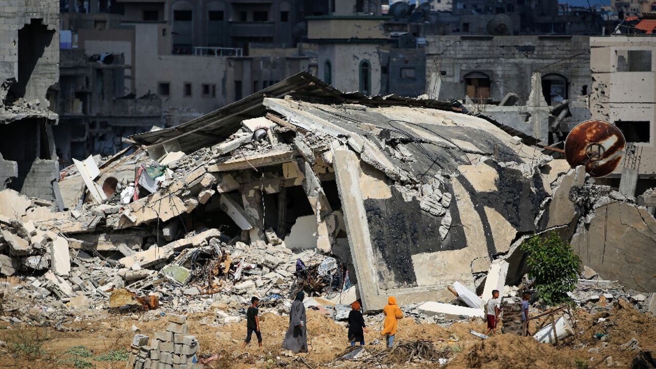 Destroyed buildings in southern Gaza's main city of Khan Yunis, where Israeli forces struck after a rocket barrage Destroyed buildings in southern Gaza's main city of Khan Yunis, where Israeli forces struck after a rocket barrage