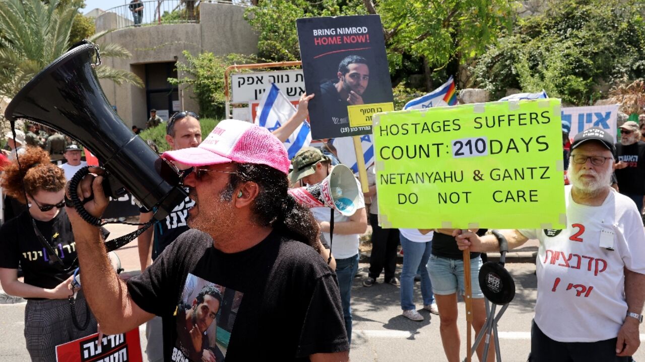 Yehuda Cohen, one of the most outspoken of the families of hostages held in Gaza, demonstrates outside a minister's house