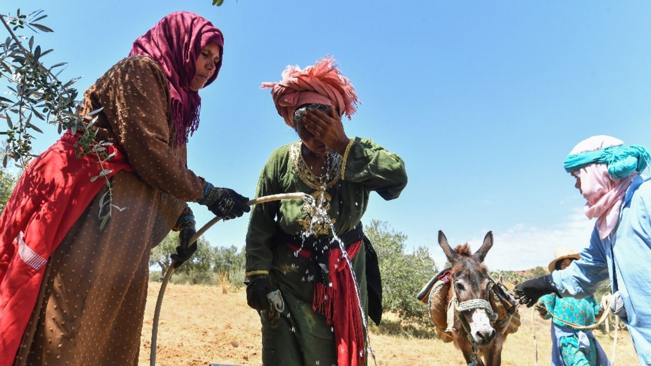 'Most families come to fetch water while we're working, and sometimes we can't do both,' said Djaouher Kammoun, a 26-year-old farmer 'Most families come to fetch water while we're working, and sometimes we can't do both,' said Djaouher Kammoun, a 26-year-old farmer