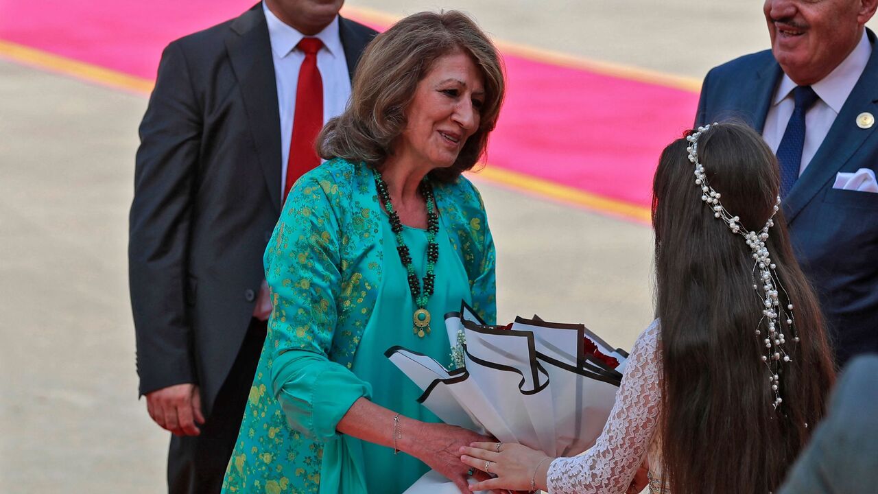 Iraq's new first lady and Iraqi-Kurdish politician and writer Shanaz Ibrahim Ahmed receives a bouquet of flowers during her husband's inauguration and handover ceremony as the new Iraqi president at al-Salam Palace in the capital Baghdad on Oct. 17, 2022.