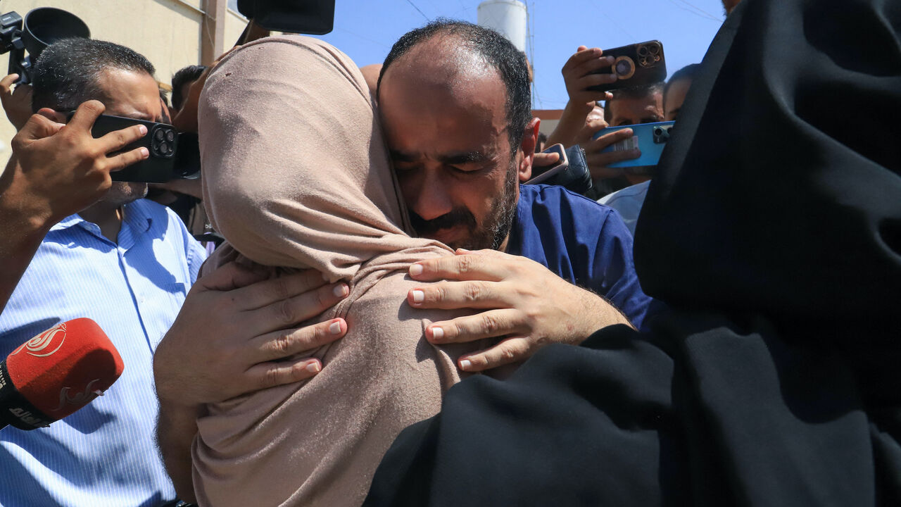 Al-Shifa hospital director Mohammed Abu Salmiya who was detained by Israeli forces since November, is welcomed by relatives after his release alongside other detainees, at Nasser hopsital in Khan Yunis in the southern Gaza Strip July 1, 2024, amid the ongoing conflict between Israel and the Palestinian Hamas militant group. 