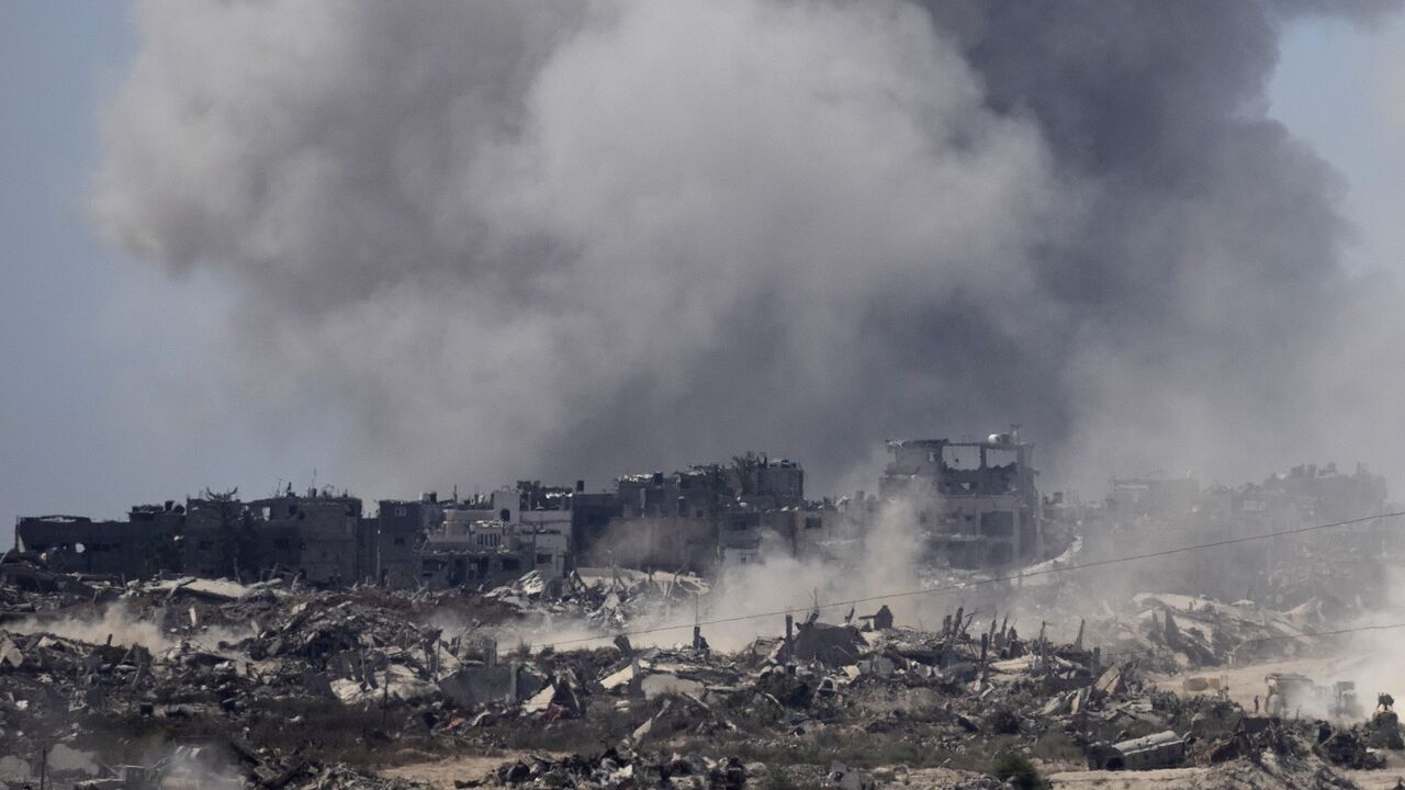 Smoke rise over the Gaza Strip after an Israeli bombardment as seen from a position on the Israeli side of the border on July 3, 2024 in Southern Israel.