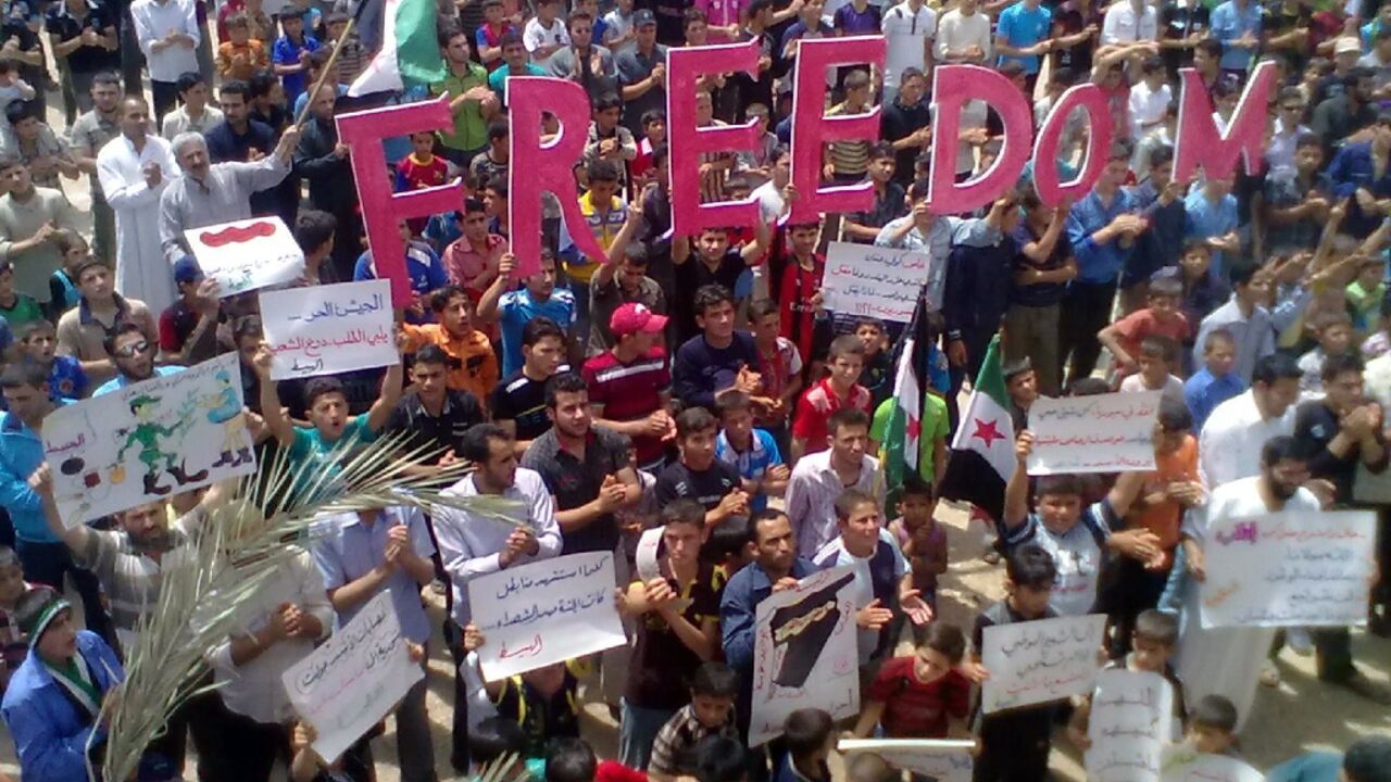 Suspects were arrested in Sweden and Germany over alleged 2012 abuses over Syrian protests, similar to the one shown in this image Suspects were arrested in Sweden and Germany over alleged 2012 abuses over Syrian protests, similar to the one shown in this image