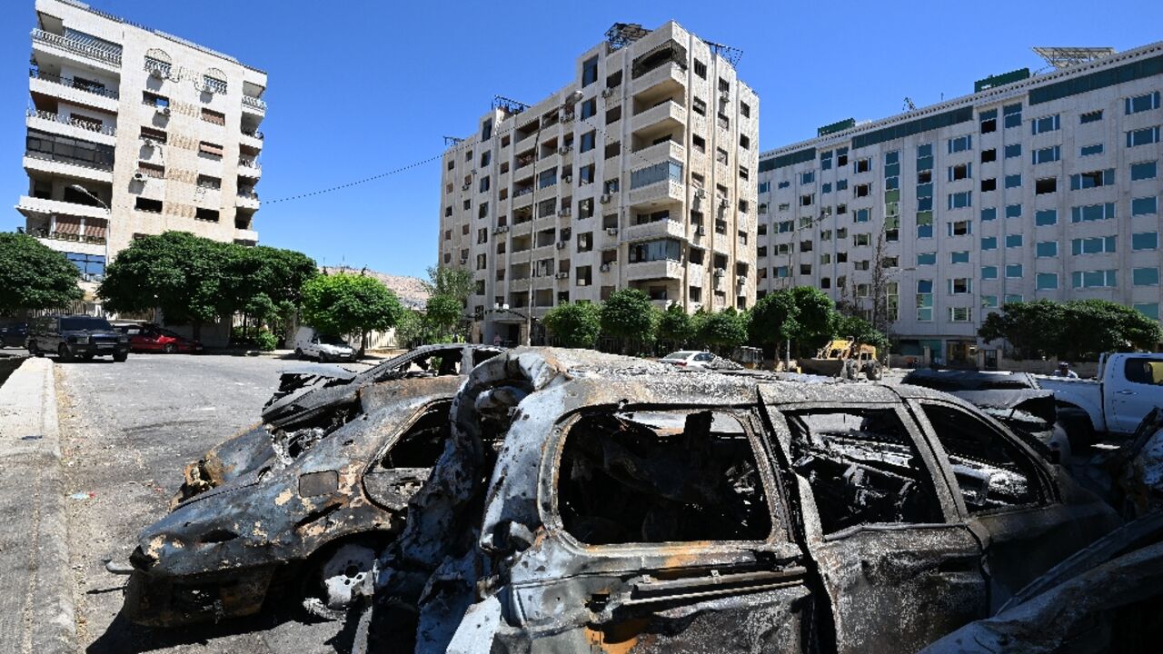 Charred cars in a parking lot after an Israeli strike on Damascus's Kafr Sousa district Charred cars in a parking lot after an Israeli strike on Damascus's Kafr Sousa district