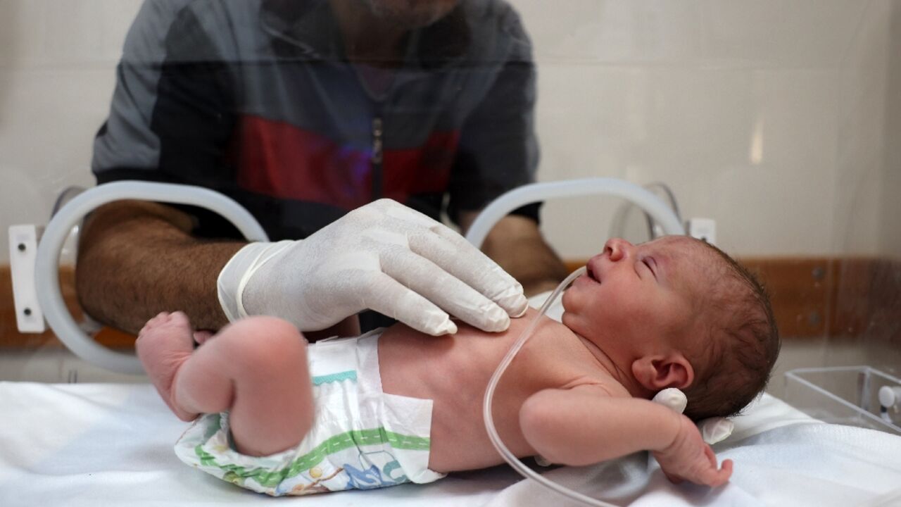 Baby Malek Yassin was delivered by emergency Cesarean section after his mother died of wounds sustained in an Israeli strike, doctors at Gaza's Al-Awda Hospital say