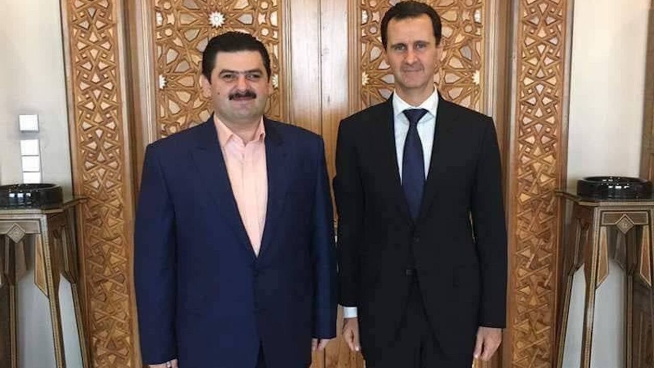 An undated image of Baraa al-Qaterji (L) with Syrian President Bashar al-Assad