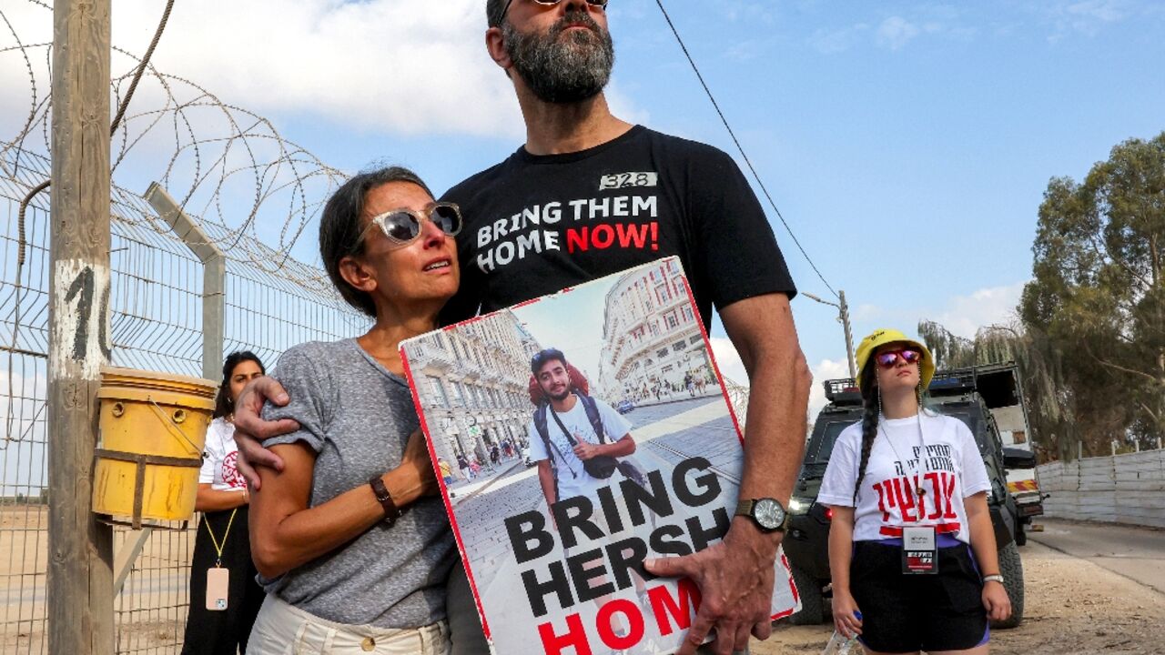 Rachel Goldberg-Polin and her husband Jonathan attend a demonstration near Kibbutz Nirim by the border with Gaza