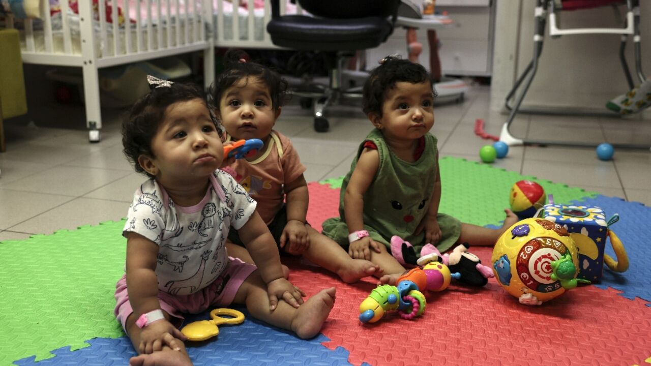 Palestinian triplets Najmeh, Najoua and Noor Bayouk have not seen their mother Hanane since shortly after their birth in August last year. The war that has engulfed her native Gaza has prevented her from returning to Jerusalem to pick them up Palestinian triplets Najmeh, Najoua and Noor Bayouk have not seen their mother Hanane since shortly after their birth in August last year. The war that has engulfed her native Gaza has prevented her from returning to Jerusalem to pick them up