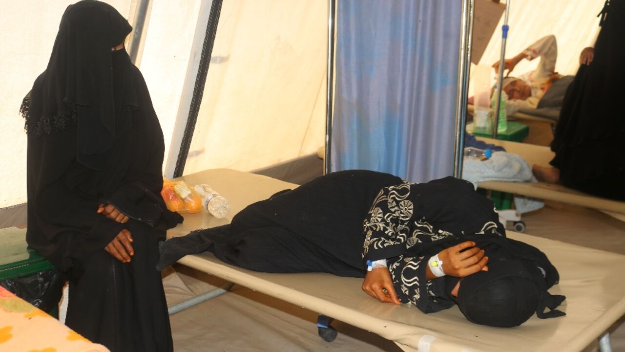 Cholera patients receive treatment at a clinic in Hais district, south of the rebel-held Yemeni port city of Hodeida