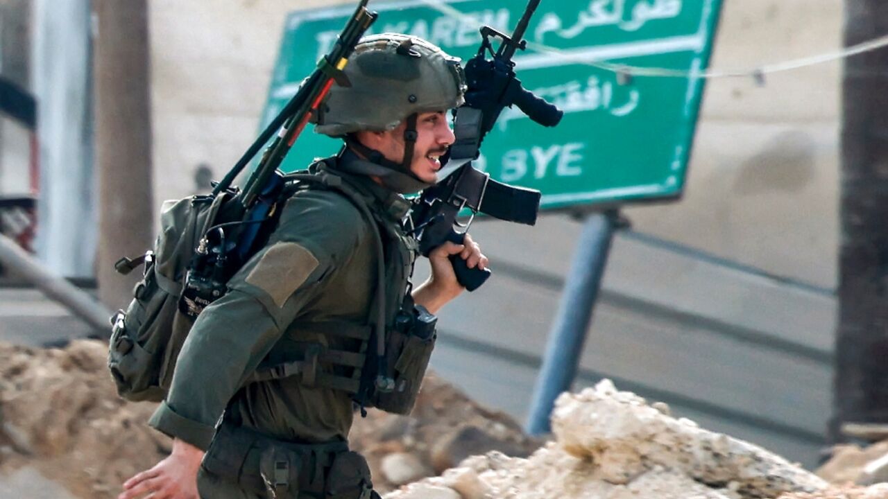 An Israeli soldier takes position during a raid on the West Bank city of Tulkarem on the second day of a major military operation in the north of the occupied territory An Israeli soldier takes position during a raid on the West Bank city of Tulkarem on the second day of a major military operation in the north of the occupied territory