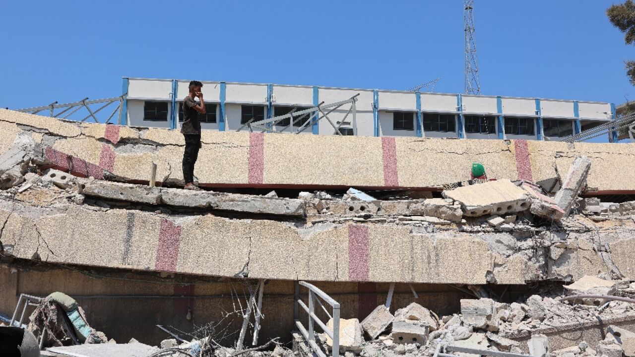 A man inspects damage after an Israeli strike on a school building in Gaza City